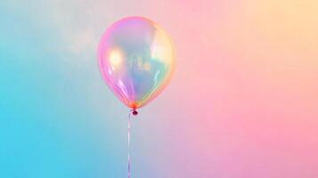 Iridescent balloon floating against a pastel gradient backdrop, creating a vibrant and whimsical atmosphere. Perfect for parties photo