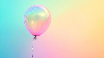 A captivating balloon ascends, its translucent surface reflecting a colorful sky. The balloon is tethered by a delicate, curling ribbon. photo