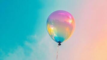 A single, iridescent balloon floats in a serene sky, a vibrant celebration of color against a backdrop of pastel hues and gentle clouds. photo