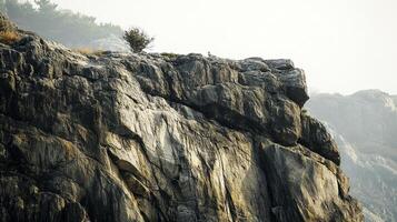 A dramatic cliff face with intricate rock formations, showcasing nature's raw beauty and geological history under an overcast sky. photo