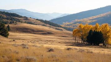 Autumn landscape with golden hills, distant mountains, and vibrant trees creating a scenic and tranquil mountain vista. photo