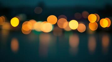 Abstract bokeh lights over water, creating a warm glow against a dark background. Evening mood with reflected light. photo