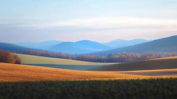 Rolling hills create a tranquil landscape, with distant mountains fading into a soft, hazy blue sky. Serene nature scene. photo