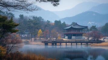 Pagoda on misty lake in a serene landscape, autumnal colors reflecting in the tranquil waters, mountains in distance, ethereal atmosphere. photo