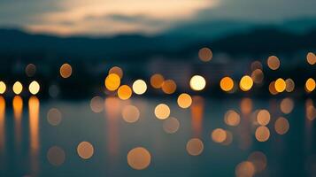 Blurred cityscape at night. Bokeh lights sparkle on the water, reflected with soft sunset tones and dark mountains in the backdrop. photo