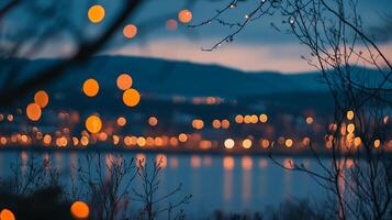 Blurred lights sparkle over a serene lake at dusk, framed by silhouettes of branches, creating a magical, dreamy atmosphere. photo