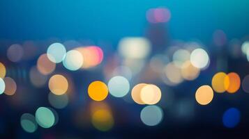 Abstract city night lights bokeh. Out of focus colorful city lights in circular shapes against a dark backdrop with shades of blue. photo