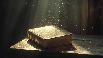 A golden book rests in the sunlight, surrounded by sparkles of magic, creating a sense of wonder and enchanting storytelling. photo