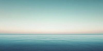 A serene seascape captivates with a calming horizon, gentle water ripples, and a gradient sky transitioning from blue to soft pastels. photo