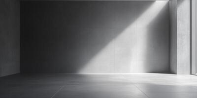 Sunlight illuminates a minimalist, monochromatic interior with concrete textures and an interplay of light and shadow in a serene space. photo