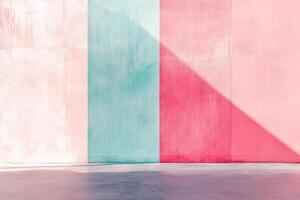 Abstract wall with colorful pastel paints in pink, teal, and red, divided into sections, and partially illuminated by sunlight. photo