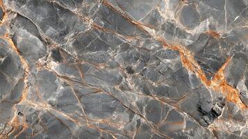Stone surface with intricate veins creating a textured, natural pattern. Gray and orange create a striking visual effect. photo