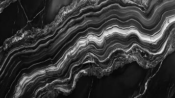 Monochrome waves cascade across a mineral surface, revealing layers of sediment transformed by time and pressure into a timeless spectacle. photo