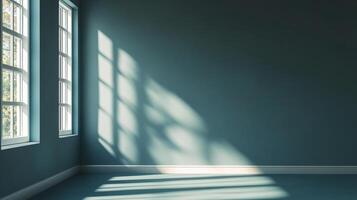 Sunlight streams into a serene teal room through gridded windows, casting intricate shadows that dance across the walls and floor. photo