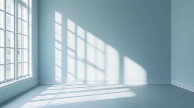Sunlight streams through a multi-pane window, casting geometric shadows on the floor and light blue walls, creating a serene atmosphere. photo