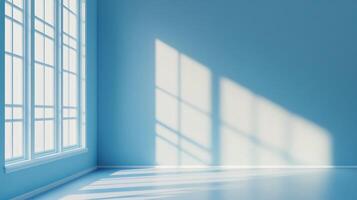 Light streams through a window in an empty blue room, creating bright and airy atmosphere with shadow patterns on the wall and floor. photo