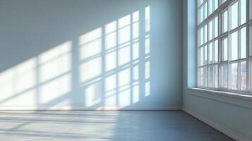 Sunlight streams through a large, divided window illuminating a modern, light-colored, empty room creating strong shadow patterns. photo