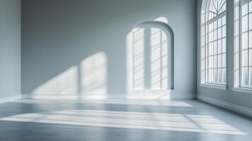 Sunlight streams through windows, creating an elegant shadow play on the empty grey room's floor, highlighting architectural details. photo