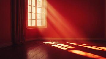 A sunlit room interior showcasing light streaming through a window casting shadows across the floor in an empty space with red walls and a curtain. photo