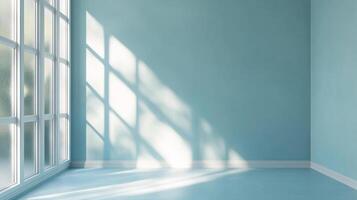 Bright room with natural light streaming through a window, creating patterns on the light blue wall and floor. Calm and serene atmosphere. photo
