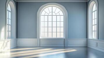 Bright, light-filled room with large arched windows and simple wall paneling. Sunlight creates patterns on the floor, creating a tranquil scene. photo