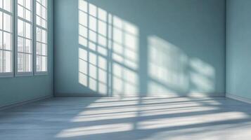 Sunlight streams through windows, casting shadows on the blue walls and floor of an otherwise empty room, creating a serene atmosphere. photo
