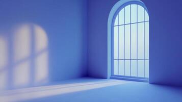Blue hued empty room featuring large arched window with light streaming in and casting shadows on the wall and floor. Serene, peaceful space. photo