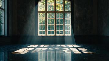 Sunlight streams into a shadowy room through a large window, illuminating the floor with a captivating display of light and shadow. photo
