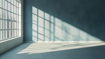 Sunlight streams into a sparse, modern interior, creating dynamic shadows and highlighting the textured wall and spacious room. photo