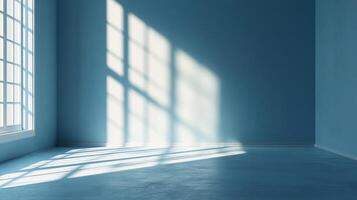 Sunlight streams through a window in a monochromatic blue room, casting shadows and highlighting the texture of the wall and floor. photo