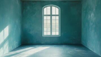Empty teal room with an arched window casting shadows on the floor, creating a tranquil and minimalist space for contemplation. photo