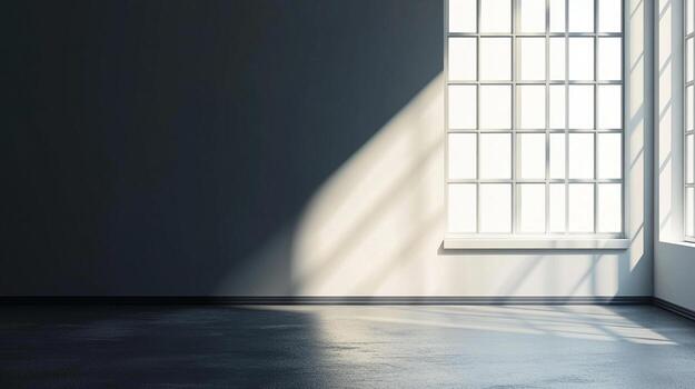 An empty room with a dark floor is illuminated by a window with panes, casting light across the room and creating a contrast. photo