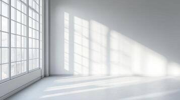 Sunlight streams into an empty room, illuminating white walls and casting shadows from a large window. A minimalist, peaceful interior. photo