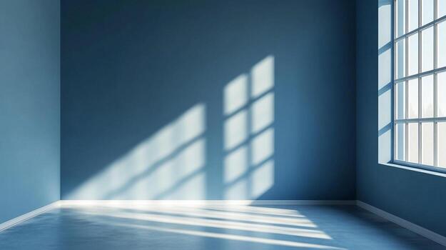 Sunlight streams into a blue room through a large window, creating geometric patterns on the wall and floor. Minimalist and serene space. photo