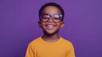 Smiling boy with glasses in front of a purple background, radiates joy and charm. His cheerful face and bright smile captivate viewers. photo