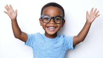 Happy child smiling with glasses and arms raised on plain background. Expressing joy and positivity. Young boy with great enthusiasm. photo