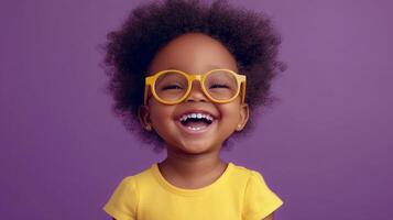 A happy child with glasses laughs brightly, radiating pure joy. Her infectious smile and cheerful demeanor are simply heartwarming. photo
