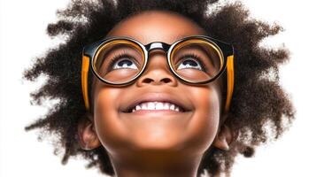 A young child gazes upward with a hopeful expression, their eyes sparkling with curiosity behind trendy glasses. photo