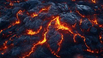 Molten rock is flowing, solidifying as it cools. The contrast is striking as red hot lava spreads across the black volcanic surface. photo