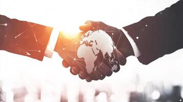 Global partnership represented by a handshake with a world map overlay, symbolizing international collaboration and connections. photo