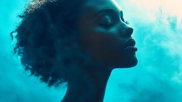 Contemplative beauty with closed eyes in serene setting, lit with cool blues and soft smoke, evokes calmness and introspection. photo