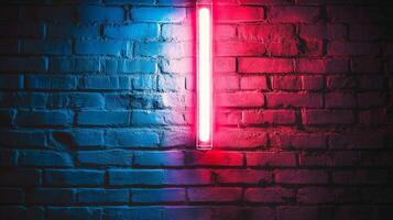 Blue and red light illuminates a weathered brick wall with a single neon light fixture casting a vibrant glow on the textured surface. photo