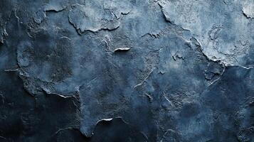 Dark, textured surface with layers and cracks resembling stone or weathered material, ideal for backgrounds or artistic effects. photo