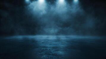 Dark blue room with a foggy atmosphere. The room is empty and has no furniture. The lighting is dim and the room is filled with smoke photo