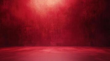 Abstract deep red textured surface with a subtle gradient lighting effect. Great for backgrounds, banners, product displays and more. photo