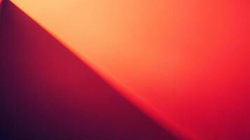 Abstract red and orange gradient with a sharp angled shadow splitting the image into contrasting light and dark halves with smooth textures. photo