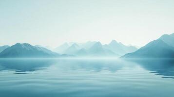 Serene mountain range reflecting in calm waters, captured in a soft, misty light, evoking tranquility and the beauty of nature. photo
