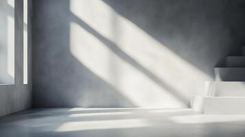 Sunlight streams into a modern, minimalist room with grey walls and stairs, creating a bright and airy atmosphere with light and shadow play. photo