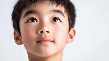 A captivating close-up of a young person with dark hair looking upwards in awe, showcasing a serene and contemplative moment of reflection. photo