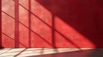 Abstract red wall illuminated by window shadows, creating a geometric pattern and adding depth and warmth to the composition. photo